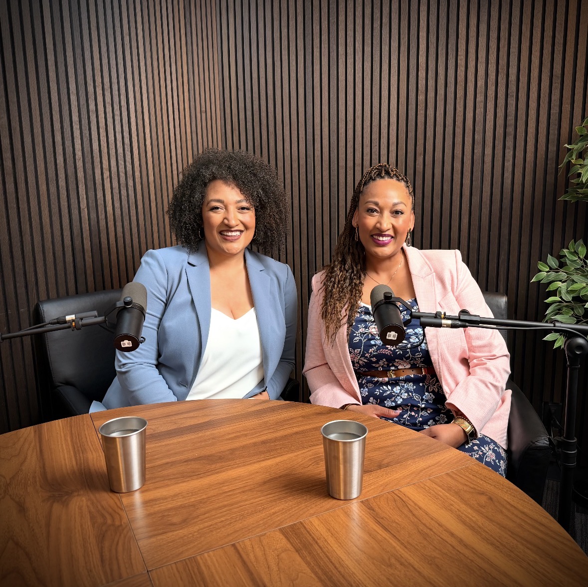 Alexis Bradley and Chanté Stutznegger seated at microphones