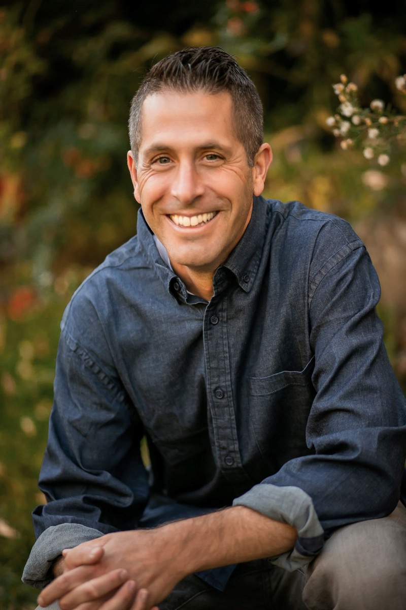 Matthew C. Godfrey smiling outdoors