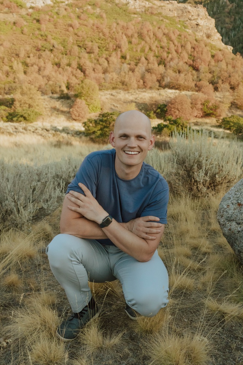 Orion Maxfield crouching outdoors